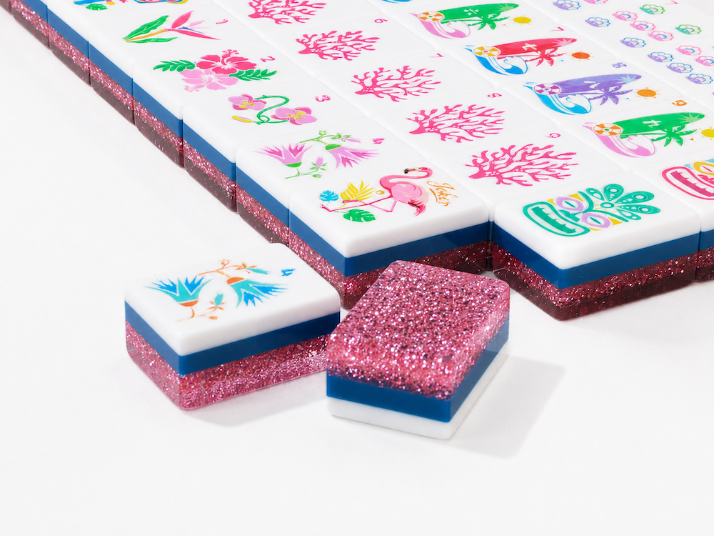 Getaway Pink Stardust — close-up of tropical tile faces and pink glitter back #Colorway_Pink Stardust