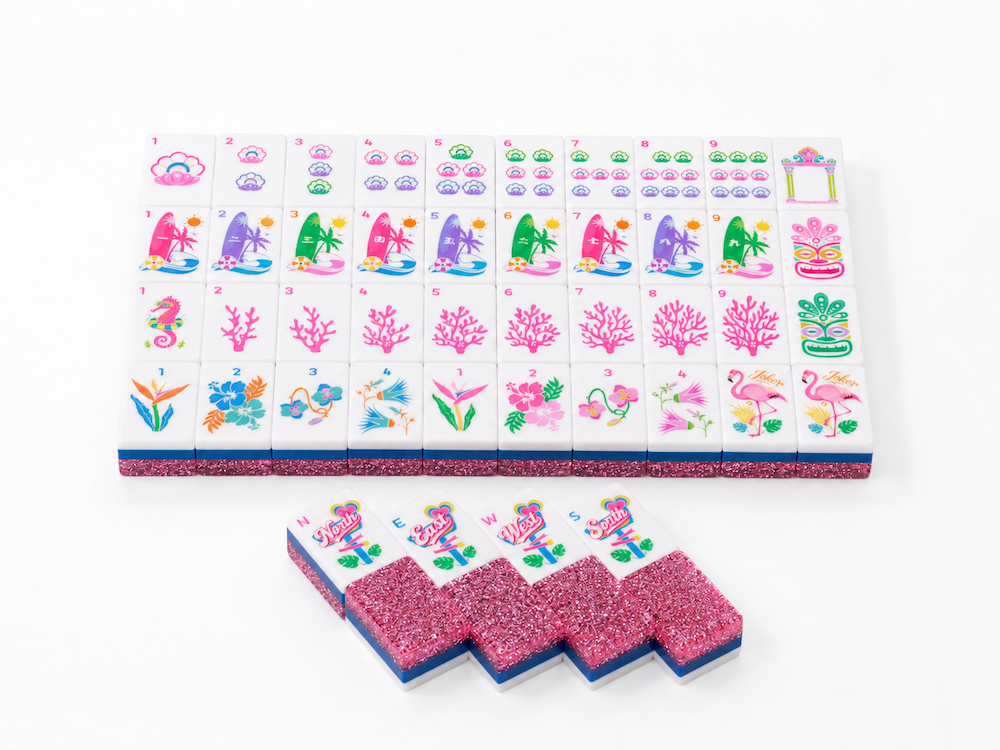 Mahjong tile tray with colorful illustrated tiles and pink glitter spare tiles