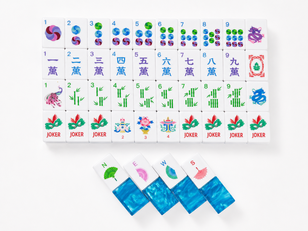 Azure Tide mahjong tile set showing joker tiles and mixed character, bamboo, and flower faces.