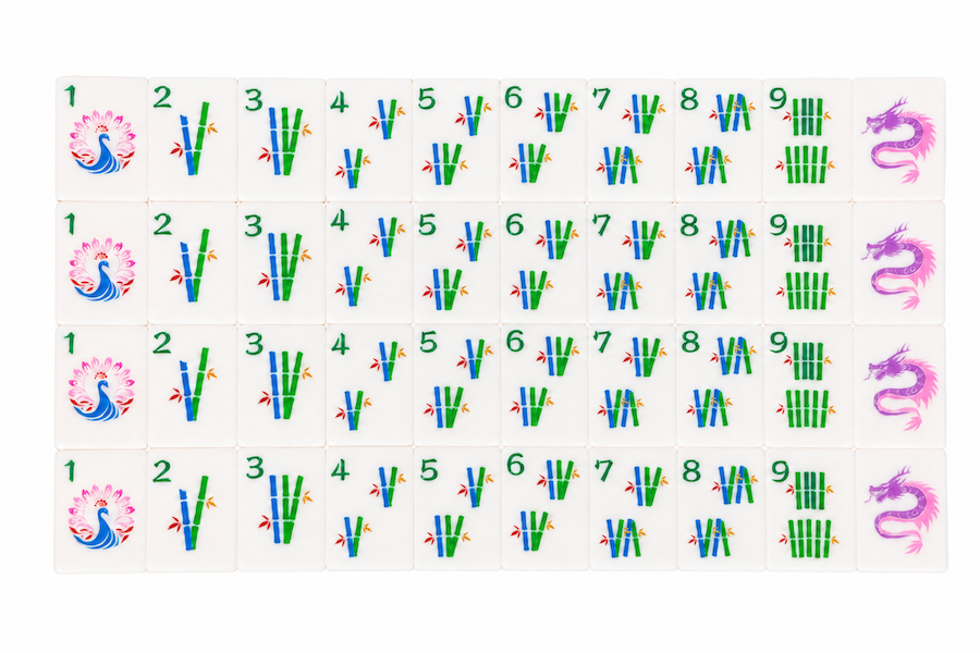 Face-up mahjong tile layout with colorful dot, bamboo, and character tiles