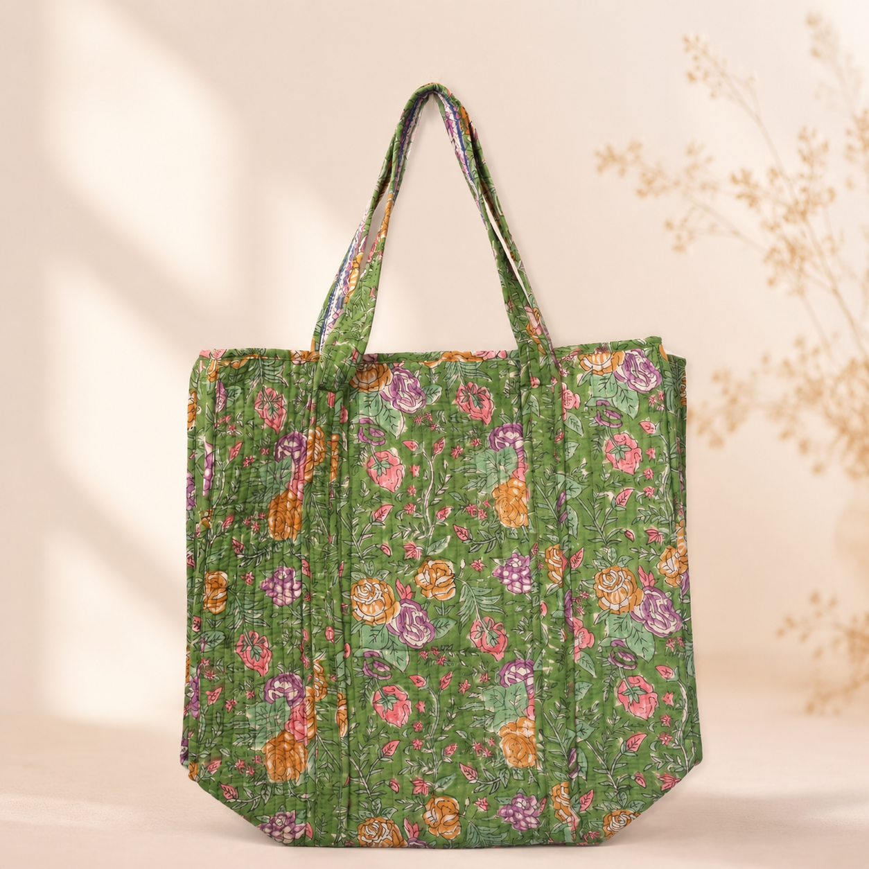 Green floral quilted cotton tote bag with two fabric handles and open top