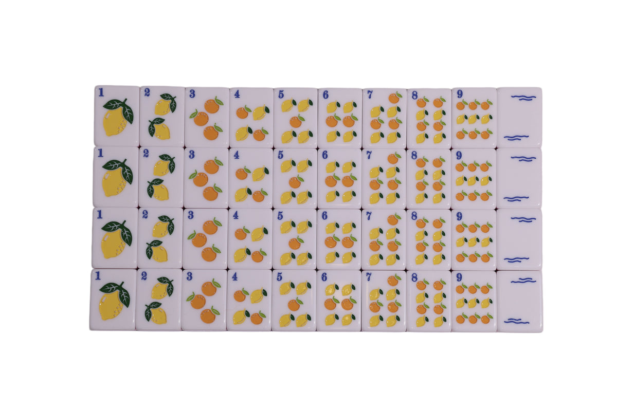 Orchard fruit print fabric with rows of numbered apples and lemons