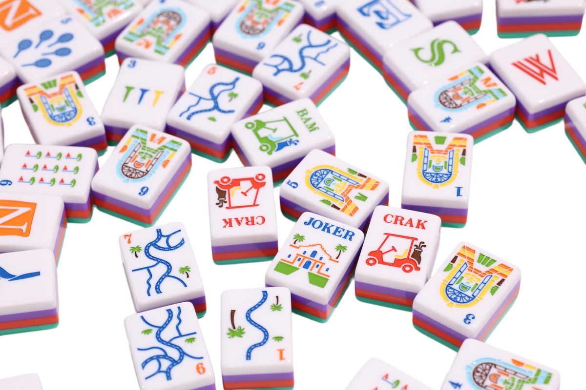 Resort Riviera Green mahjong tiles with golf-course faces and colorful layered edges #Colorway_Riviera Green