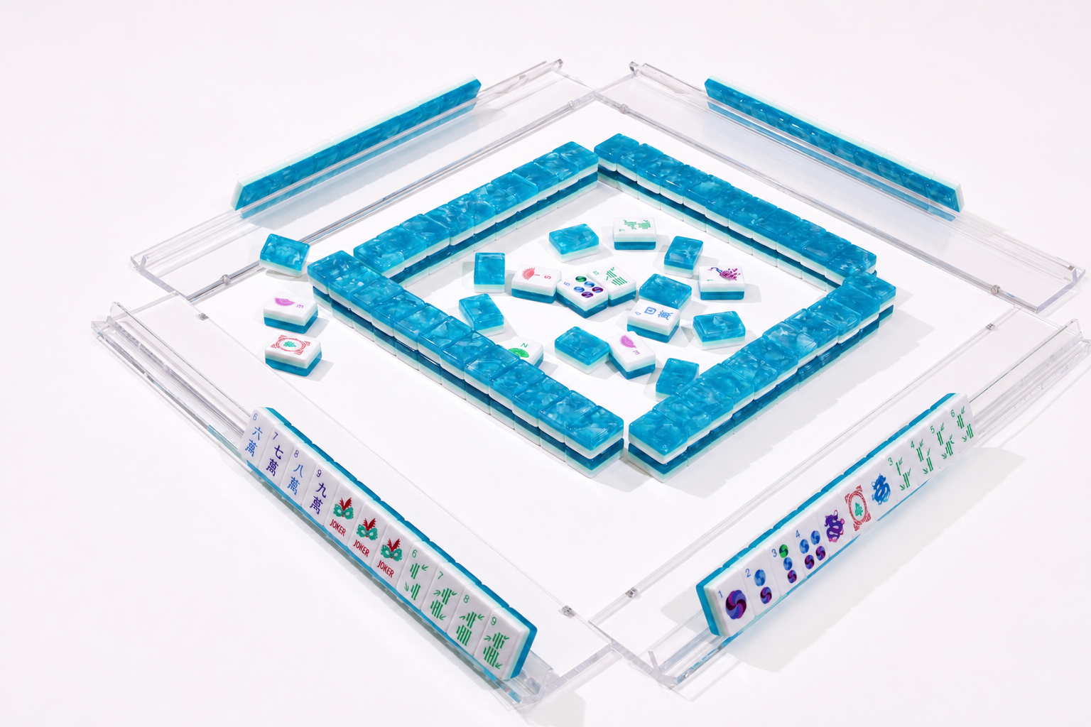 Top-view mahjong table mat with blue border, clear frame, and stacked tiles in center