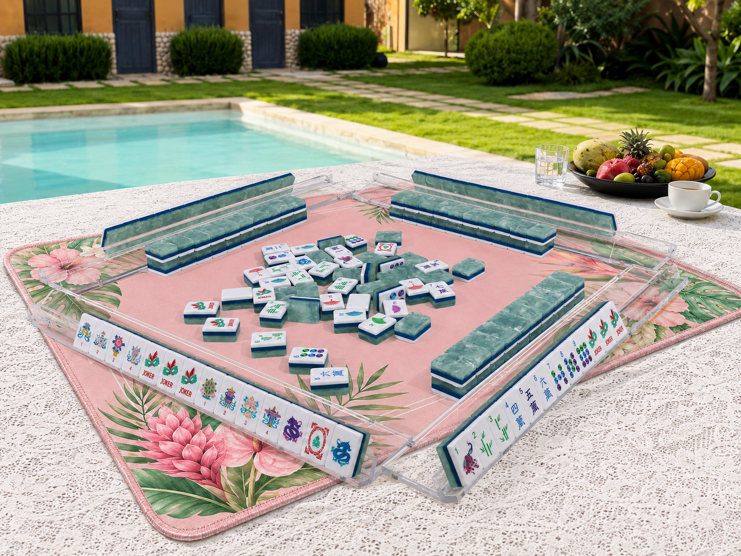 Mahjong table mat with floral art and jade-green tiles scattered for play