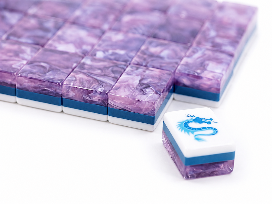 Purple marble-backed mahjong tiles in a row, with one loose tile ahead