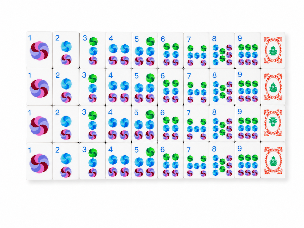 Azure Tide mahjong tile set close-up showing numbered and decorative tile faces in rows.