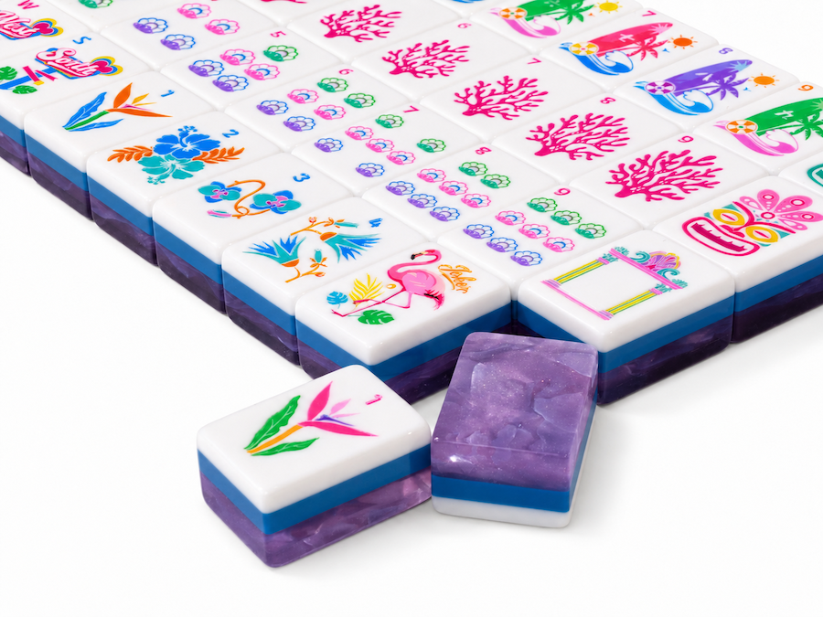 Getaway Amethyst Mist American Mahjong tiles with tropical faces and pearlescent purple backs