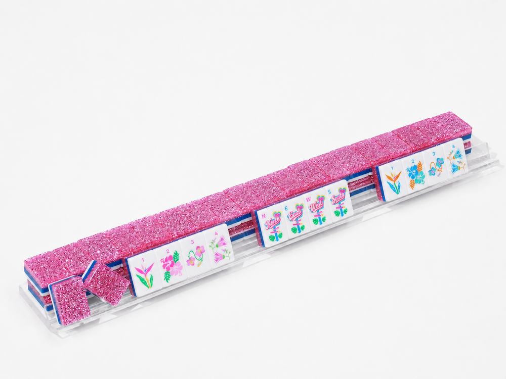 Long row of pink glitter mahjong tiles with colorful illustrated end pieces