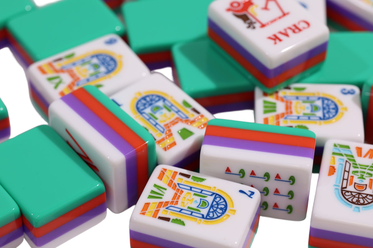 Close-up of Resort Riviera Green mahjong tiles showing glossy green backs and striped layers #Colorway_Riviera Green