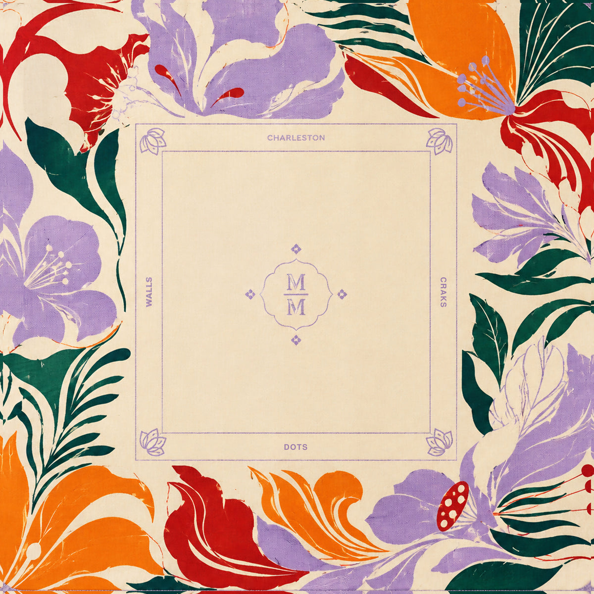 Cream mahjong mat with thin border, corner symbols, and central MM monogram.