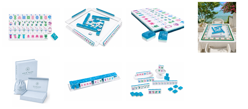 Mahjong tile set shown with accessories, including tiles, racks, and packaging
