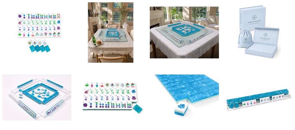Mahjong tile set shown with tray, table mat, loose tiles, and boxed packaging