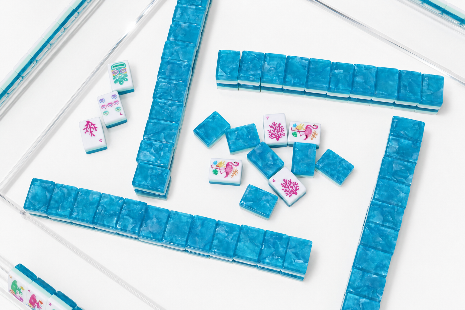 Overhead view of arranged blue mahjong tile walls with symbol tiles