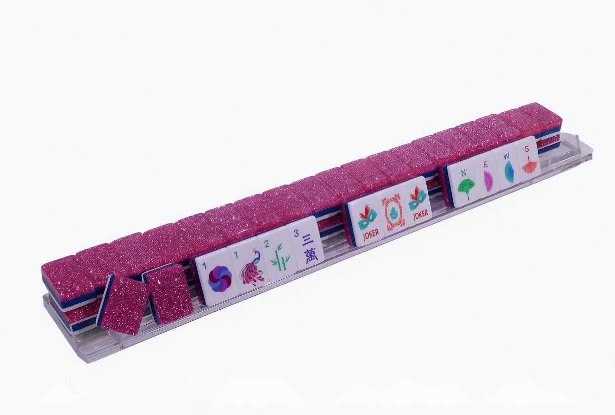 The Parlor Table Pink Stardust Mahjong tiles displayed at an angle on a clear acrylic rack