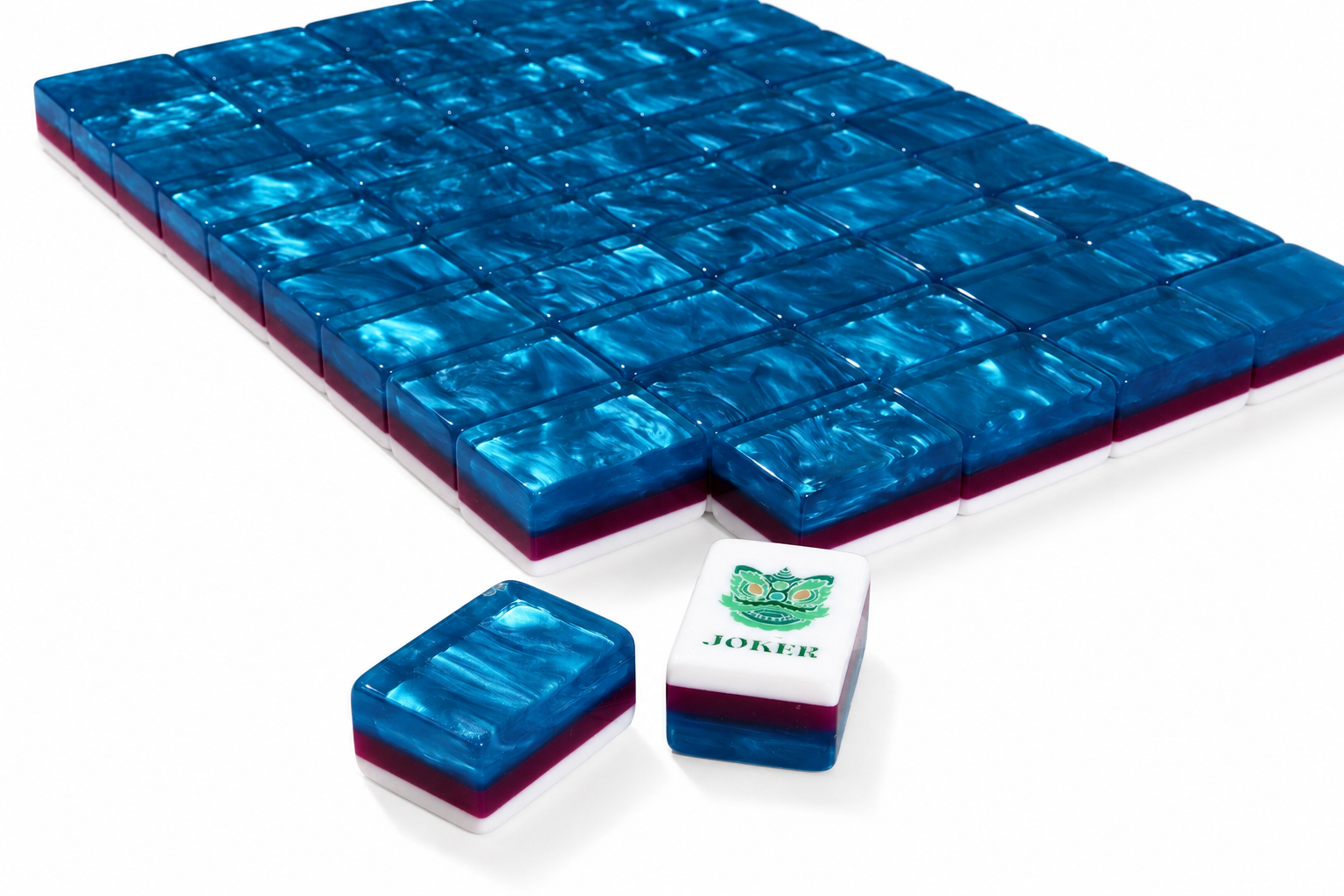 Blue mahjong tile set with embossed grid and small matching tile rack