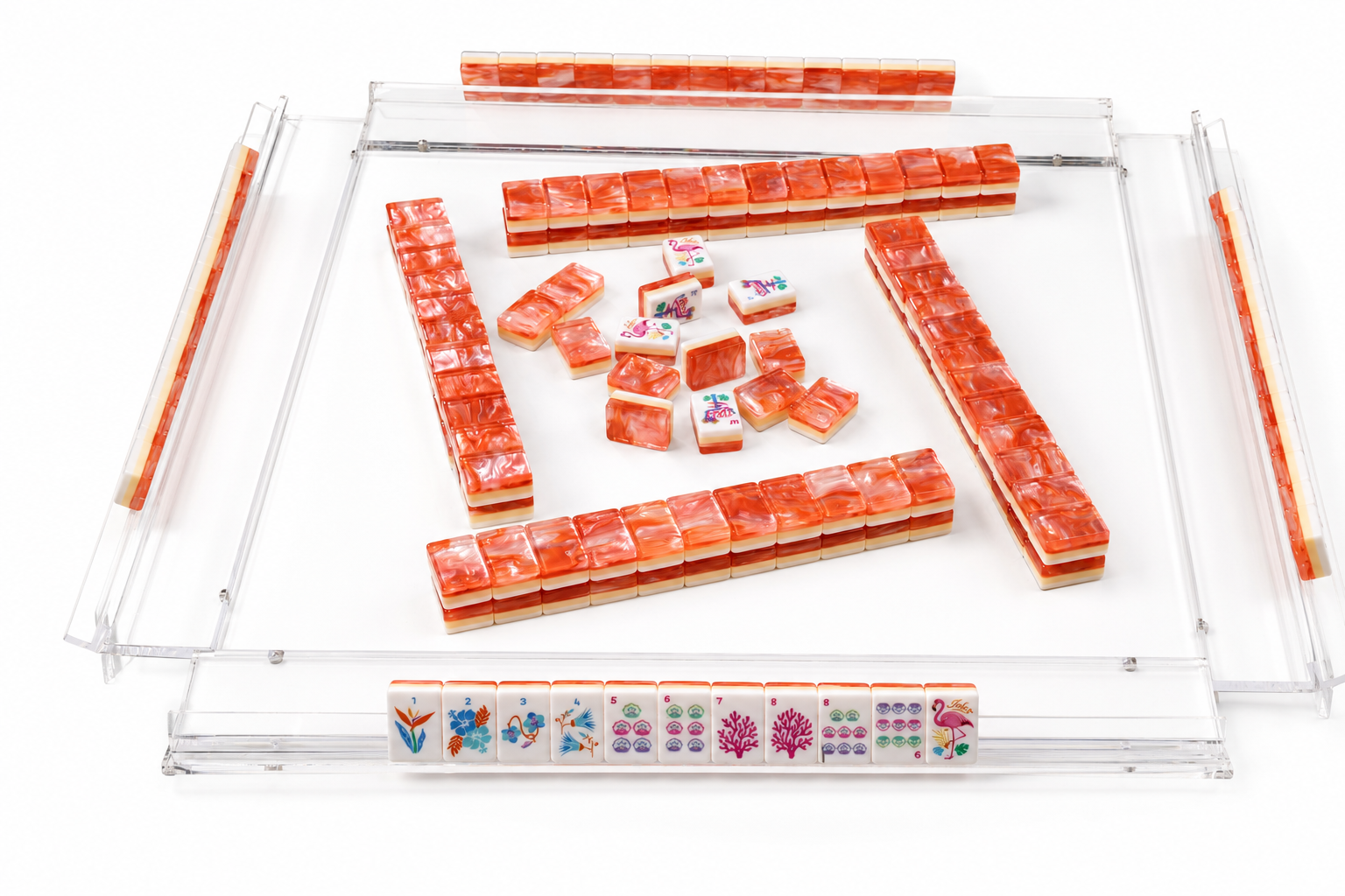 Mahjong tile tray with coral-orange letter tiles and small colorful tile row