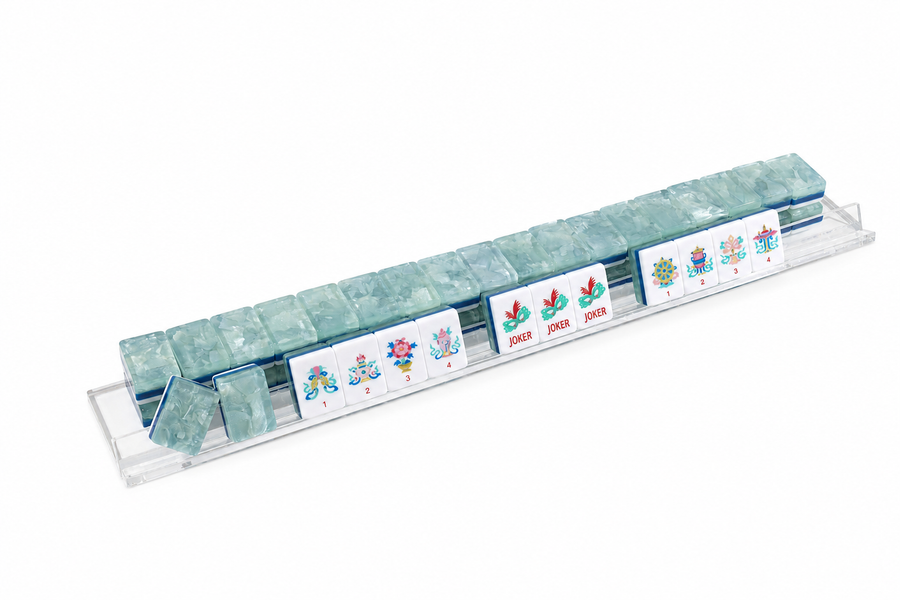 Row of jade-green mahjong tiles with white face tiles and small themed tile pieces
