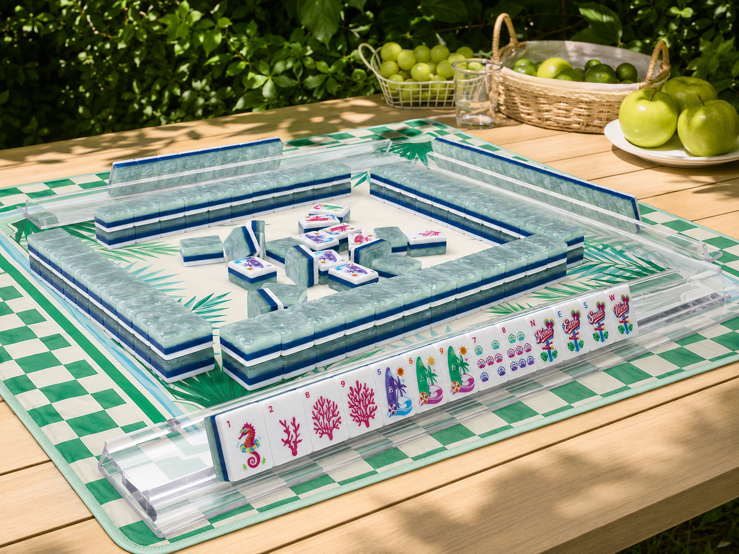 Mahjong tile table with colorful face tiles in a clear tray and border